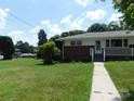 Front yard view of the brick ranch home at 209 Lloyd St, Salisbury, NC 28144