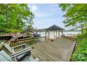 Lakefront dock with multiple slips and seating at 80 Fairview Farms Rd, Shelby, NC 28150