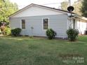 Side view of the house showcasing the gray siding and windows at 115 Sunrise Cir, Shelby, NC 28150