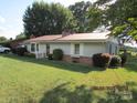 Ranch home with a carport and well-maintained lawn at 115 Sunrise Cir, Shelby, NC 28150