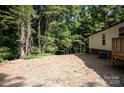 The home's backyard is mostly clear and level, with some landscaping at 2574 Orchard Rd, Smyrna, SC 29743