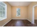 Bright spare bedroom with laminate wood flooring and window at 1021 Wall St, Statesville, NC 28677