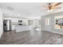 Modern kitchen with white cabinets, granite countertops, and LVP flooring at 540 Porter Rd, Rock Hill, SC 29730