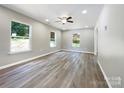 Bright living room featuring hardwood floors and large windows at 48 Magnolia St, York, SC 29745