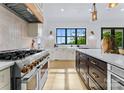 Luxury kitchen with high-end appliances and large island at 18304 Rosapenny Rd, Charlotte, NC 28278