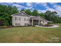 Ranch style home with covered porch and landscaped yard at 213 Press Sweezy Rd, Kings Mountain, NC 28086
