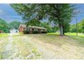 Brick ranch house with detached garage and large yard at 2501 Twin Ave, Gastonia, NC 28052