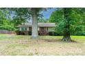 Brick ranch house with large yard and mature trees at 2501 Twin Ave, Gastonia, NC 28052