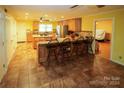 Island kitchen with granite countertops and breakfast bar at 44097 Nc 740 Hwy, New London, NC 28127