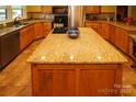 Granite countertop kitchen island with gas cooktop at 44097 Nc 740 Hwy, New London, NC 28127