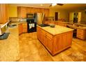 Spacious kitchen with large island and granite countertops at 44097 Nc 740 Hwy, New London, NC 28127