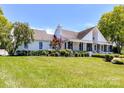 Stunning white two-story home with landscaped lawn and driveway at 3245 Jackson Rd, Mooresville, NC 28115