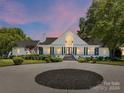Modern home with a circular driveway and landscaping at 3245 Jackson Rd, Mooresville, NC 28115