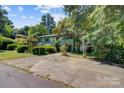 Two-story house with green accents and landscaped yard at 1099 4Th Avenue Nw Dr, Hickory, NC 28601