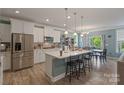 Modern kitchen with island and stainless steel appliances at 116 Hornbeam Ln, Mooresville, NC 28117