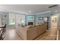 Spacious living room with corner sofa and fireplace at 116 Hornbeam Ln, Mooresville, NC 28117