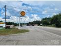 Roadside view of a highway with a gas station and other businesses at 407 Chester Ave, Great Falls, SC 29055
