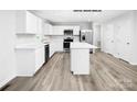 Modern kitchen with white cabinets and island at 335 Maplestead St # 1112, Lancaster, SC 29720