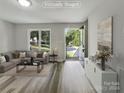 Virtually staged living room with modern furniture at 2008 Sarn Ct, Gastonia, NC 28054