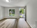 Living room with wood-look floors and access to the exterior at 2008 Sarn Ct, Gastonia, NC 28054