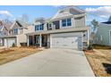 Two-story house with gray siding, stone accents, and a white door at 5312 Verona Rd # 74, Charlotte, NC 28213