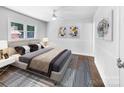 Bright bedroom with hardwood floors, double bed, and ceiling fan at 1819 Danbury St, Gastonia, NC 28052
