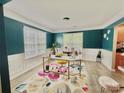 Spacious home office with a large desk, window, and stylish decor at 4141 Deerfield Nw Dr, Concord, NC 28027