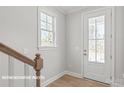 Modern entryway with door and window at 10607 Audubon Ridge Dr # 27, Cornelius, NC 28031