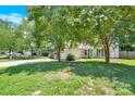 Charming house with green lawn, basketball hoop, and driveway at 6236 Old Corral St, Charlotte, NC 28277