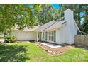 White house with green shutters and stone landscaping at 6236 Old Corral St, Charlotte, NC 28277