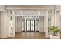 Bright and spacious entryway with hardwood floors and a large double door at 300 Spanish Oak Ln, Gastonia, NC 28056