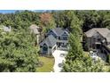 Aerial view of two story house with driveway and surrounding homes at 1106 Anniston Pl # 51, Indian Trail, NC 28079