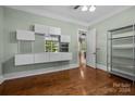 Office with hardwood floors, built-in shelving and window at 7230 Timber Ridge Dr, Mint Hill, NC 28227
