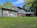 Back of house showing a sunroom and detached garage at 622 Sharon Dr, Statesville, NC 28265