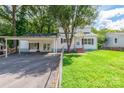 White ranch home with carport and brick steps at 1158 Evans Ave, Rock Hill, SC 29732