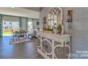 Bright entryway with a stylish console table and mirror at 219 Coronado Ave # 59, Matthews, NC 28104