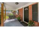 Inviting front porch with swing and potted plants at 7714 Old Waxhaw Monroe Rd, Waxhaw, NC 28173