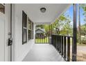 Front porch with black railings and steps at 323 20Th St, Kannapolis, NC 28083