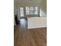 Bright living room with fireplace and view to backyard at 258 Indian Paint Brush Dr, Mooresville, NC 28115