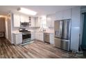 Updated kitchen with stainless steel appliances and light gray cabinets at 416 Witten Ln, Gastonia, NC 28052