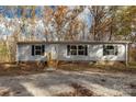 Gray manufactured home with black shutters and wood steps at 850 Mereva Rd, Smyrna, SC 29743