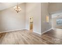 Bright dining room with hardwood floors and a chandelier at 14131 Bernardy Ln, Charlotte, NC 28269