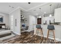 Open living area with kitchen, bedroom and workspace at 230 S Tryon St # 704, Charlotte, NC 28202