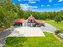 Aerial view of the property showing the house, pool, and surrounding land at 1441 Sulphur Springs Rd, Shelby, NC 28152