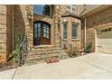 Grand entryway with double doors and stonework at 106 Liva Ln, Mooresville, NC 28117