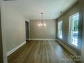 Bright dining room features hardwood floors and a chandelier at 4003 Vann Sneed Rd, Marshville, NC 28103