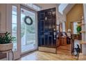 Elegant front entry with black door and view into the living room at 1602 Huntmoor Dr, Rock Hill, SC 29732