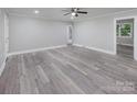 Bright living room with vinyl flooring and access to other rooms at 5625 Highway 601 Hwy, Salisbury, NC 28147