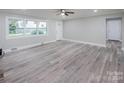 Spacious living room with gray vinyl flooring and ceiling fan at 5625 Highway 601 Hwy, Salisbury, NC 28147