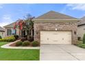 Brick ranch house with 2-car garage and landscaping at 15814 Vale Ridge Dr, Charlotte, NC 28278